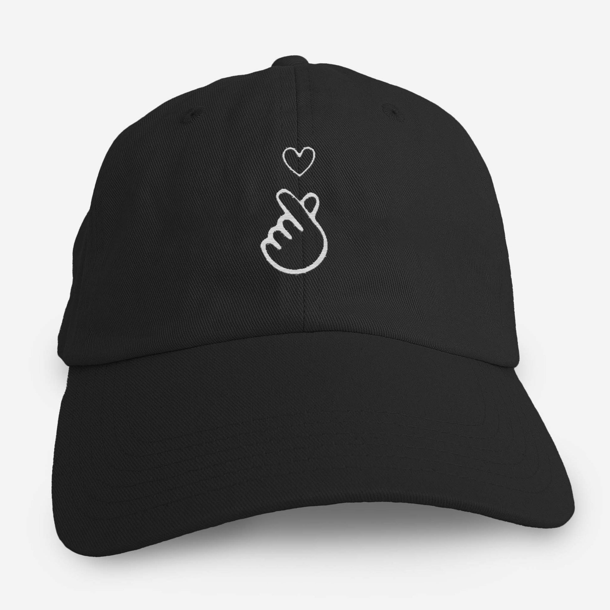 Black love hat for adults featuring minimalist finger heart design