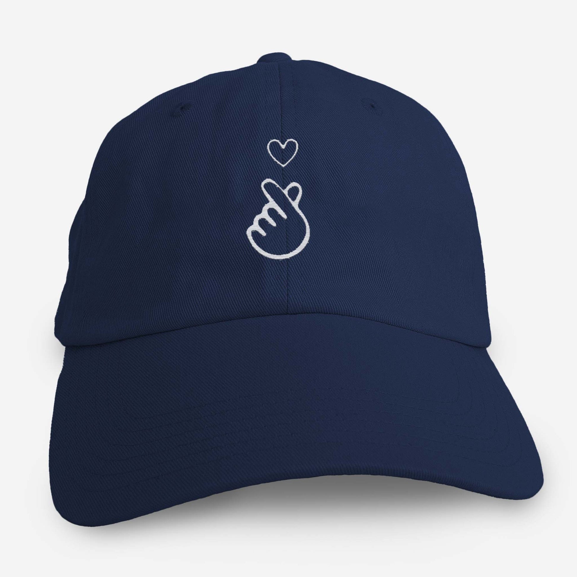 Navy blue dad hat with embroidered finger heart symbol on front